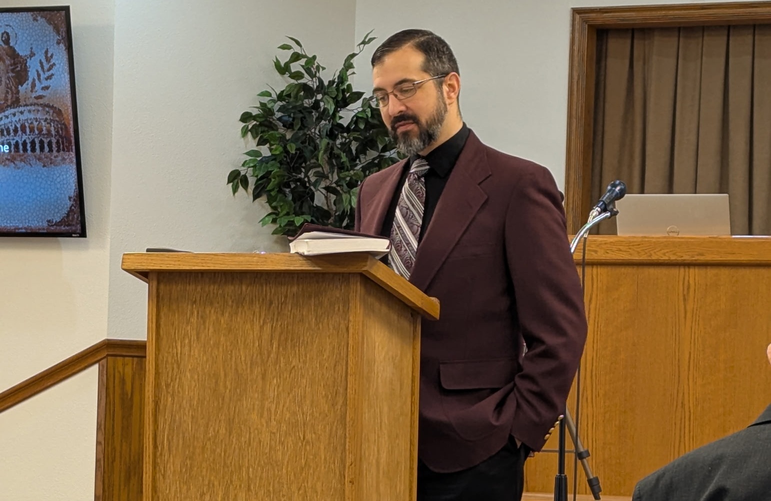 Man teaching from a pulpit.